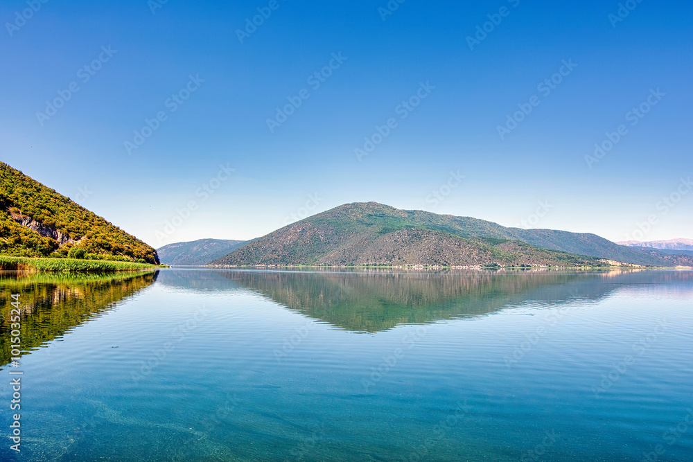 Naklejka premium Mountain Reflections on Calm Lake Prespa