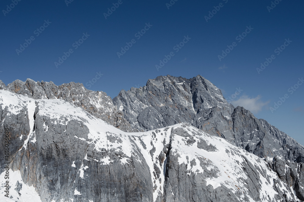 Snow-capped mountains under a clear blue sky Snow-capped mountains under a clear blue sky
