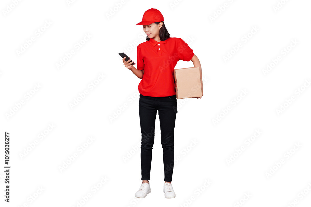 Smiling asian delivery courier woman using handphone while holding boxed package isolated transparent Smiling asian delivery courier woman using handphone while holding boxed package isolated transparent