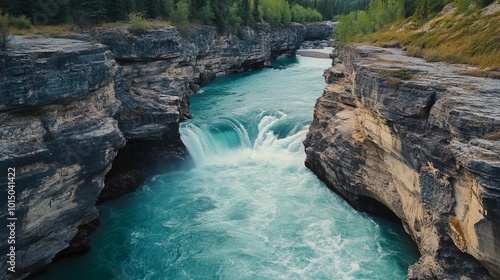 A serene river flows through rocky cliffs, showcasing natural beauty.