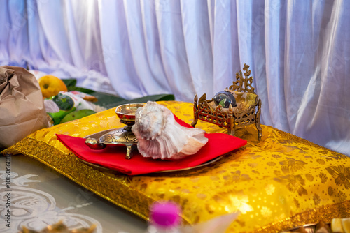 Shaligram shila,a fossilized stone or ammonite collected from riverbed of Kali Gandaki in Nepal.It is considered a form of God Vishnu. Preparation for Satyanarayan (Vishnu) pooja at a bengali home.