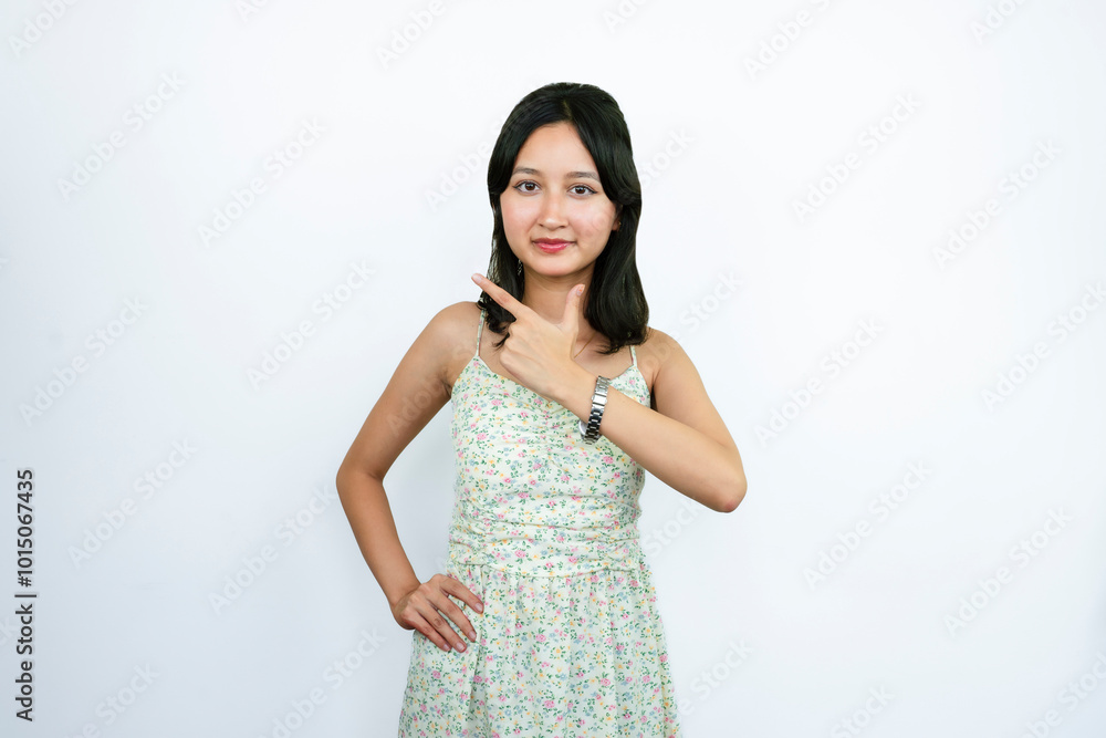 Young Asian Girl Pointing with Fingers And gives happy Expressions of Wow Young Asian Girl Pointing with Fingers And gives happy Expressions of Wow