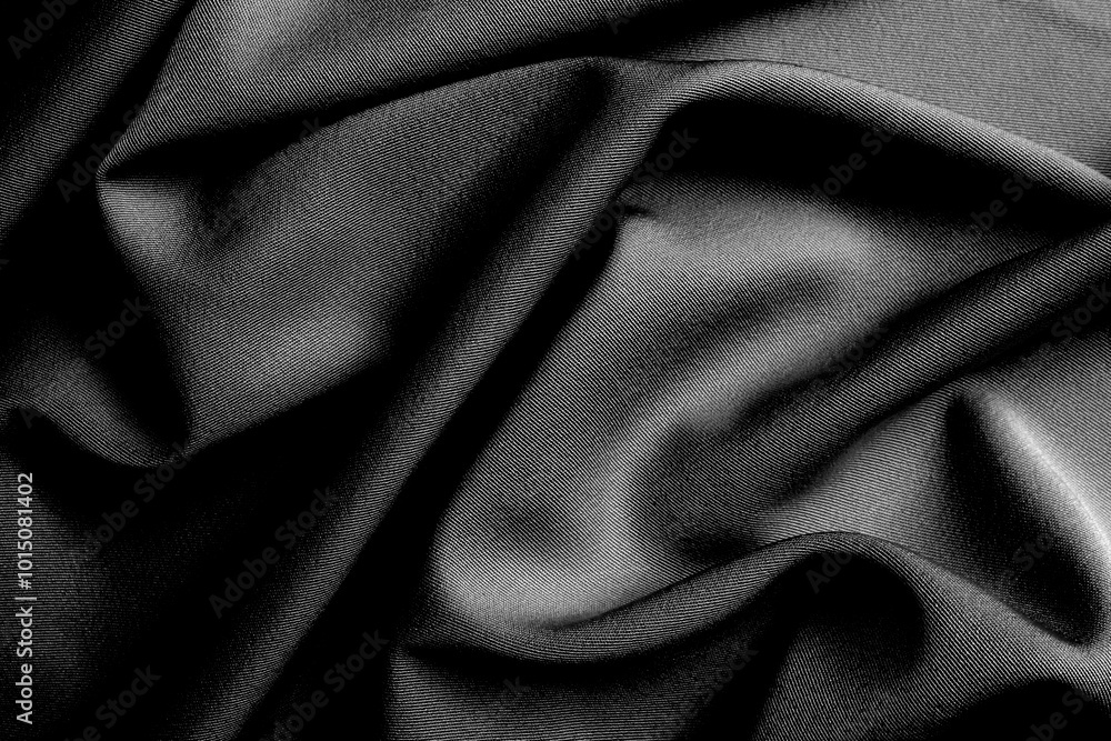 Fototapeta premium The fabric lies beautifully draped with folds of a bright, rich color.