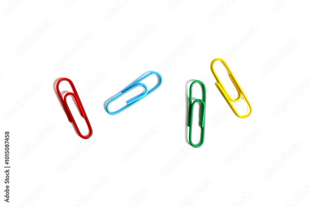 There are brightly colored paper clips on a white background.