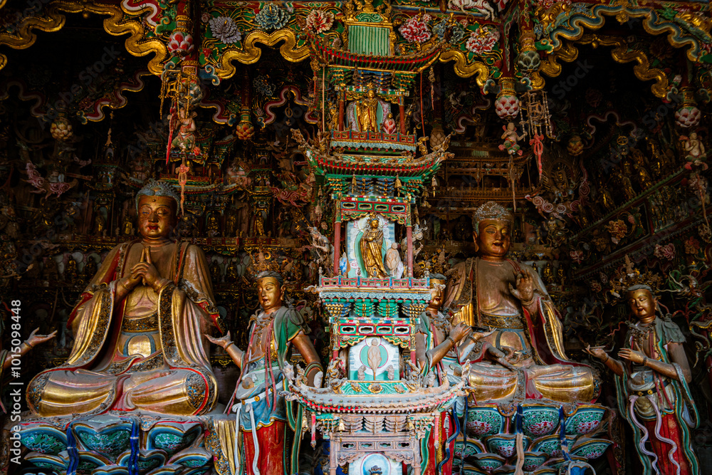 Fototapeta premium Stone statue of cross-legged Bodhisattva in Cave 18 of Yungang Grottoes, Datong, Shanxi Province