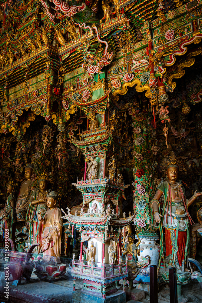Fototapeta premium Stone statue of cross-legged Bodhisattva in Cave 18 of Yungang Grottoes, Datong, Shanxi Province
