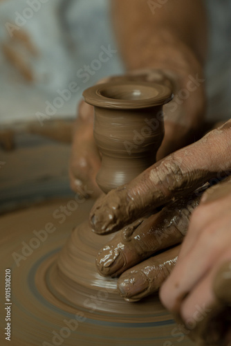 Pottery wheel lesson for adults and children. Making figures from clay.