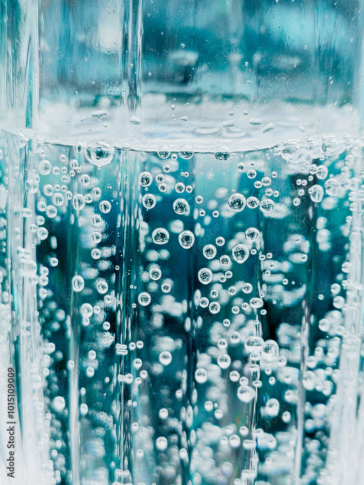 soda water bubbles sparkling transparent. Vertical photo. soda water bubbles sparkling transparent. Vertical photo.
