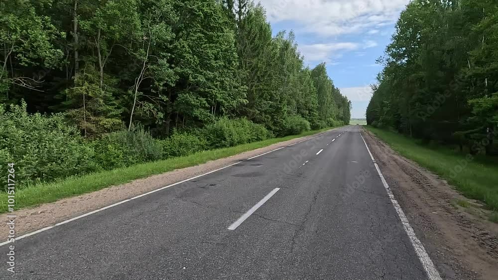 Road view on a summer day. Highways and cars, roadside and white road line markings. Road view on a summer day. Highways and cars, roadside and white road line markings.