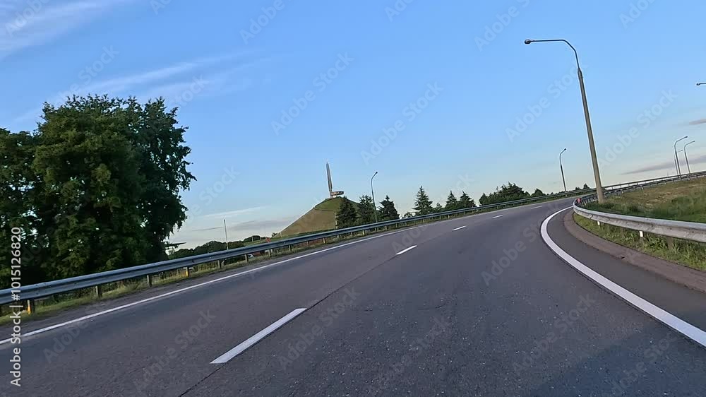 Road view on a summer day. Highways and cars, roadside and white road line markings. Road view on a summer day. Highways and cars, roadside and white road line markings.