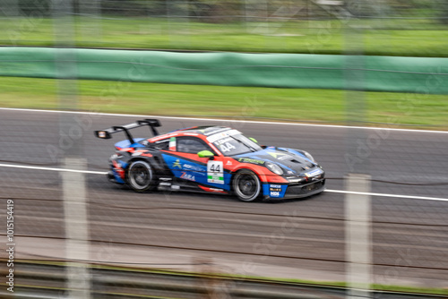 High-Speed Action at Monza Circuit: Dynamic Racing Car Captured in Motion