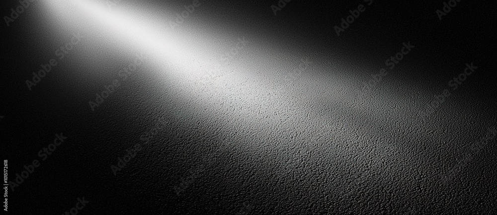 Fototapeta premium Dramatic Spotlight Beam on Dark Textured Background - Perfect for Movie Posters, Thriller Covers, and Horror Scenes