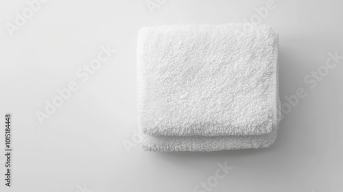 A mockup of a fluffy towel neatly folded on a pristine white background, perfect for spa or hotel promotions