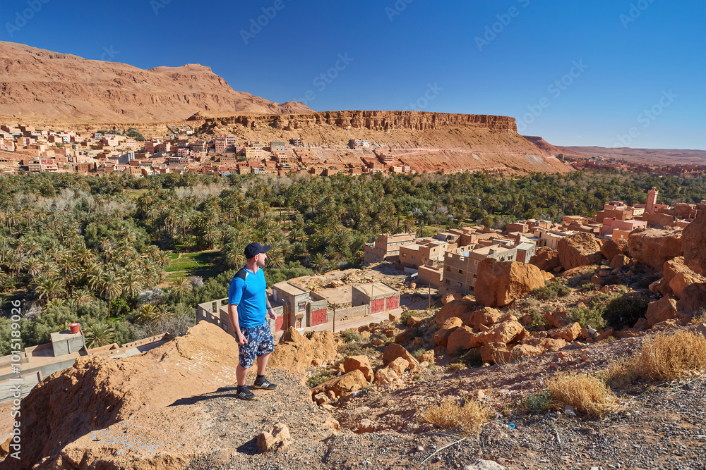 traveler stopping and enjoying the view of the gorges of Dad s in the canyons of Atlas in Morocco traveler stopping and enjoying the view of the gorges of Dad s in the canyons of Atlas in Morocco