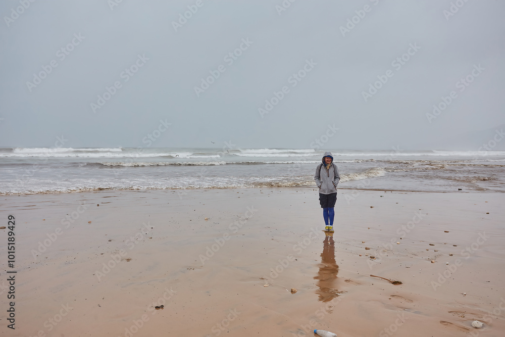Tourists on the shores of the Atlantic Ocean in Morocco. Rainy weather. Tourists on the shores of the Atlantic Ocean in Morocco. Rainy weather.