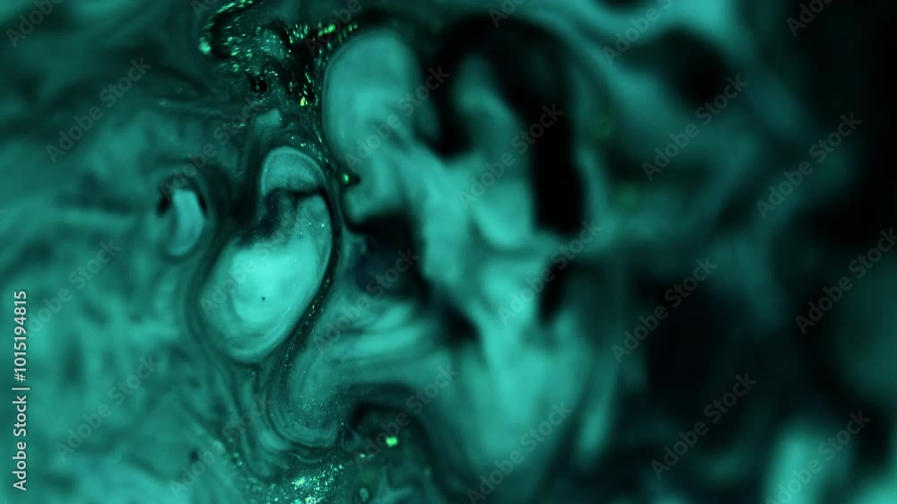 Ink splash. Shimmering fluid. Blur cyan blue black color glowing particles texture liquid mix motion abstract art background. Ink splash. Shimmering fluid. Blur cyan blue black color glowing particles texture liquid mix motion abstract art background.
