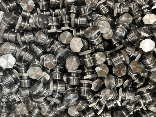 Bild auf Leinwand seamless photo of newly produced metal plugs or screws.