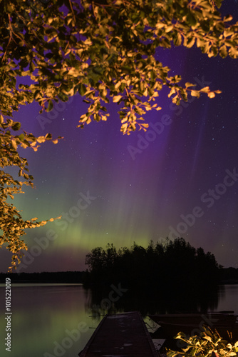 Gorgeous northern lights at the Stora Hensjön lake in Sweden. photo