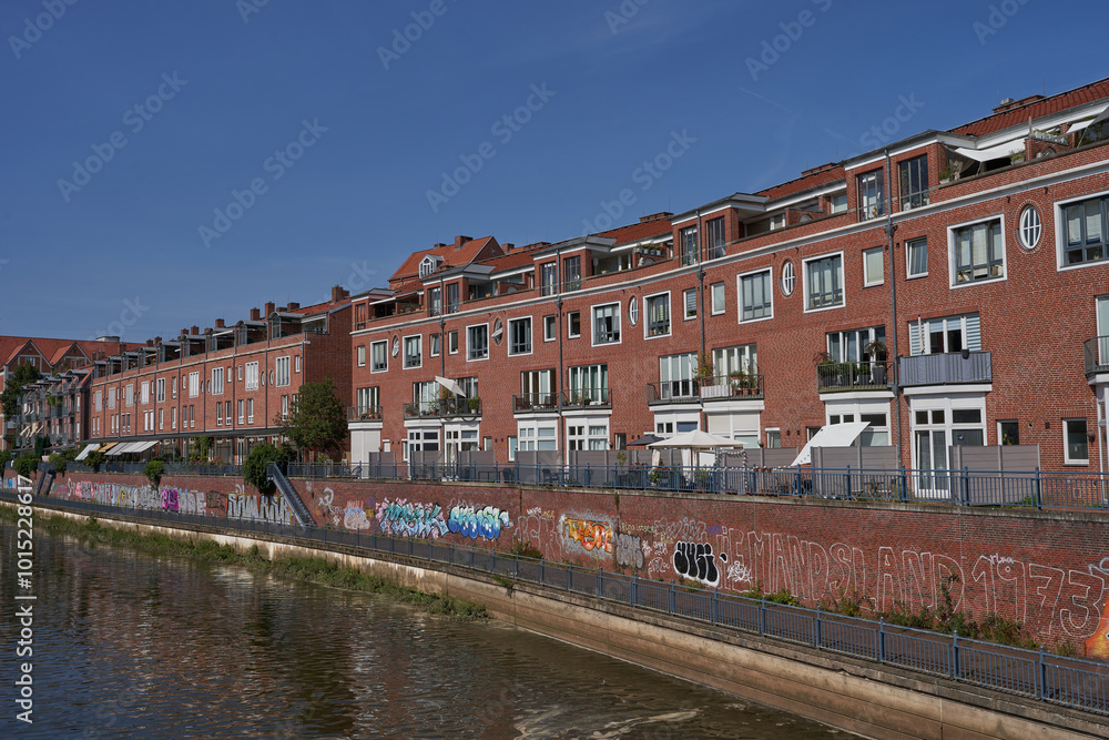 Fototapeta premium Bremen, Germany - September 1, 2024 - brick buildings at Teerhof on a sunny summer day