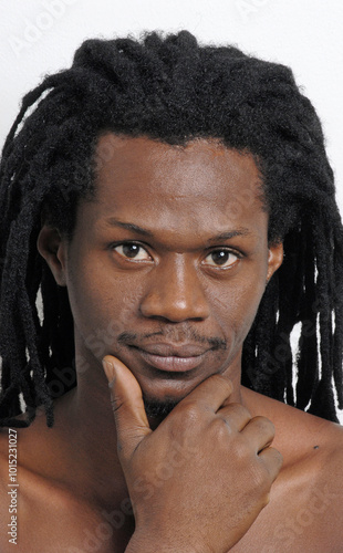 African native curly hair man hans in face portrait. photo