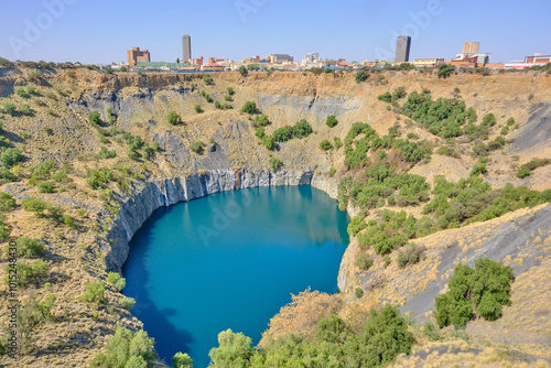 Big hole in Kimberley and city at the background ancient diamond mine in Kimberley, South Africa