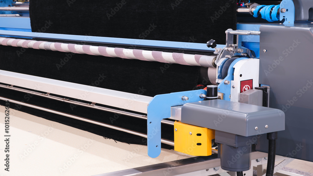 Fotografie A machine is shown with a black fabric on it