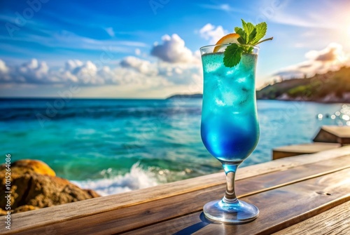 Obraz na płótnie Blue Lagoon cocktail with a sunny coastline in the background w salonie