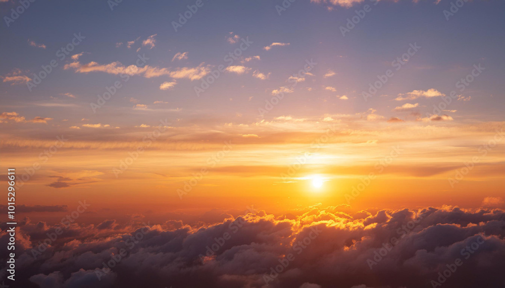 Obraz premium Sun Setting Over Clouds in Sky and Copy Space