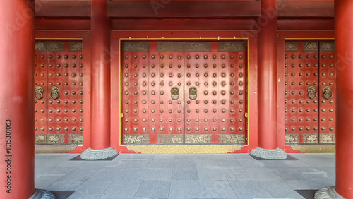 Canvas Print Close-up of a large ornate wooden door with two bronze lion-head door knockers of Buddha Tooth Relic Temple in Singapore