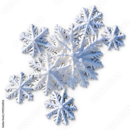 Delicate snowflakes resting gracefully on a light surface during winter months