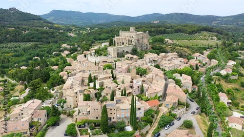 The beautiful medieval town of Le Barroux, Vaucluse, Provence, France. Aerial view of Le Barroux village with its castle, Provence, France. Perched village of Barroux and its fortified castle, France. photo