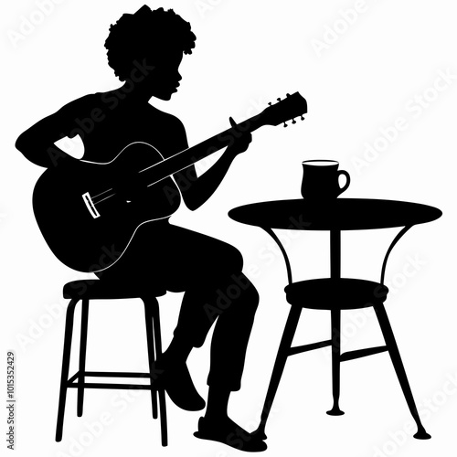 Silhouette of a woman playing acoustic guitar while sitting at a table with a coffee cup on a simple background
