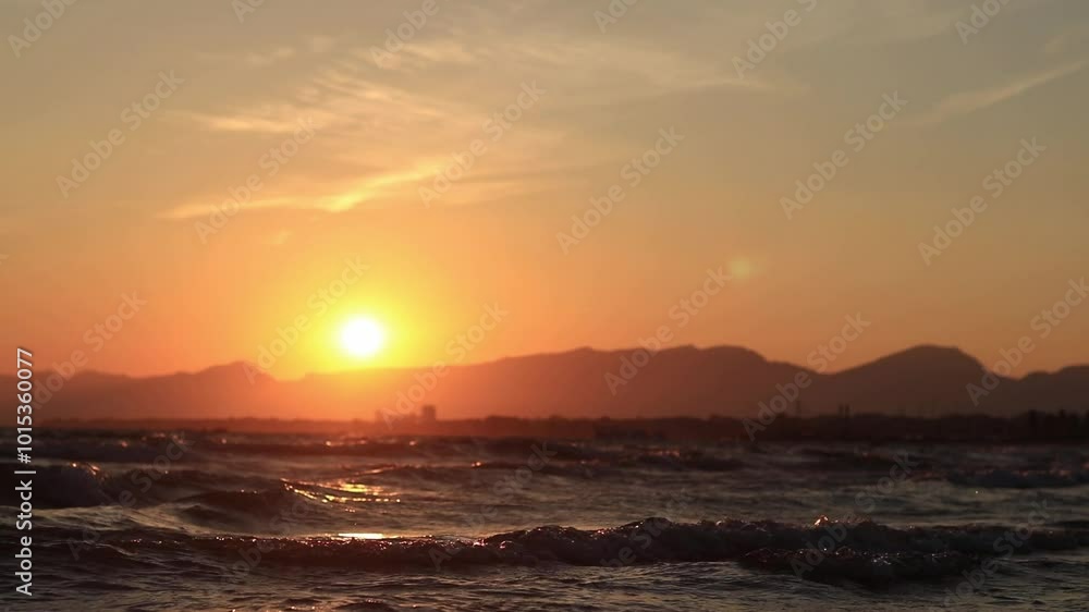 Sunset at sea. Balearic Sea, Salou, Spain. Beach, sea, small waves. Evening landscape on the coast. Vacation at sea Sunset at sea. Balearic Sea, Salou, Spain. Beach, sea, small waves. Evening landscape on the coast. Vacation at sea