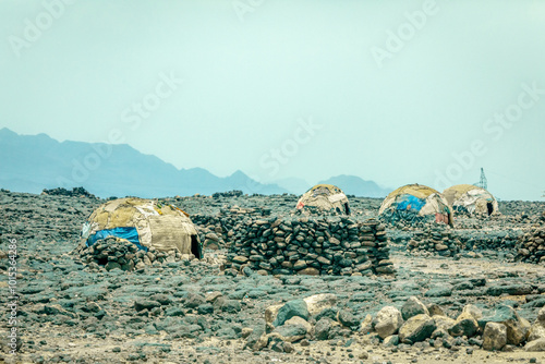 Village with poor self made houses among the stone valley at Afar, Ethiopia photo