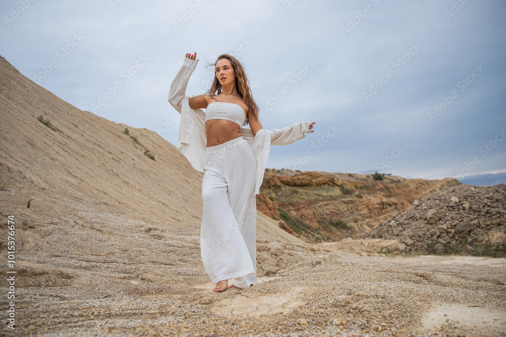 Full length portrait of a young woman posing in the Padovskiy quarry Full length portrait of a young woman posing in the Padovskiy quarry