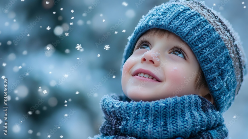Child enjoying winter snow in blue knit hat and scarf Child enjoying winter snow in blue knit hat and scarf