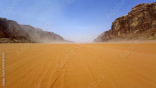 A breathtaking desert landscape featuring stunning rocky mountains in the distance. Action