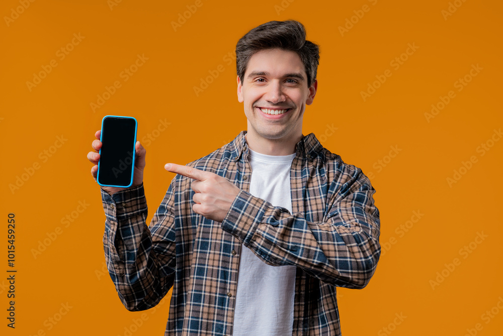 Excited smiling man, online shopping consumer. Mobile phone, smartphone mockup with copy space screen for your advertisement Excited smiling man, online shopping consumer. Mobile phone, smartphone mockup with copy space screen for your advertisement