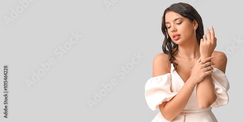 Stylish young woman with be...