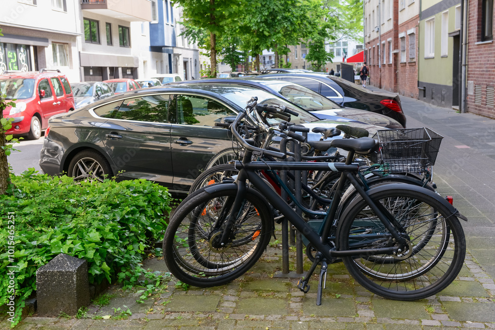 Modern bicycles parked on city street Modern bicycles parked on city street