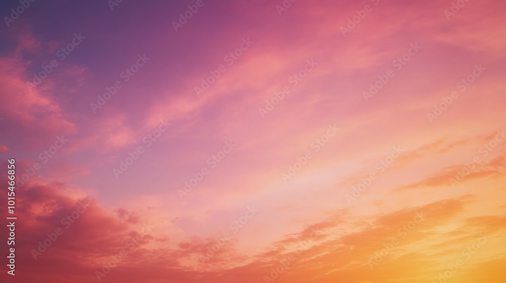 Obraz premium The dawn breaks softly across the horizon, painting the sky in gentle pinks and golds. Cloud formations stretch gracefully, bringing a sense of calm and renewal as a new day begins