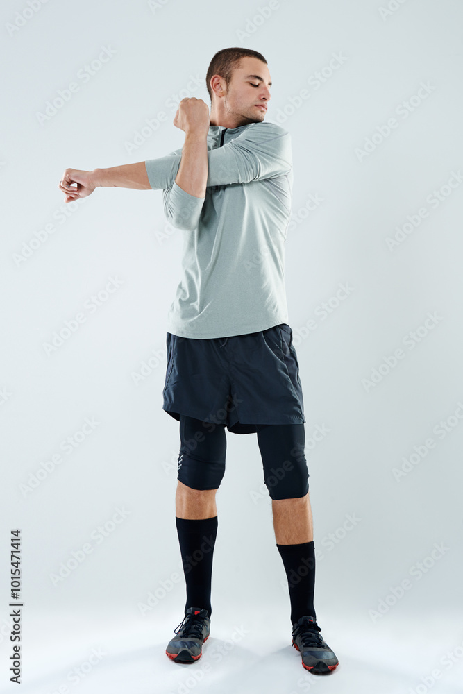 Man, runner or stretching arms in studio for flexibility for body health, fitness training and exercise. White background, muscle warm up or male athlete with wellness, mobility workout or sports Man, runner or stretching arms in studio for flexibility for body health, fitness training and exercise. White background, muscle warm up or male athlete with wellness, mobility workout or sports