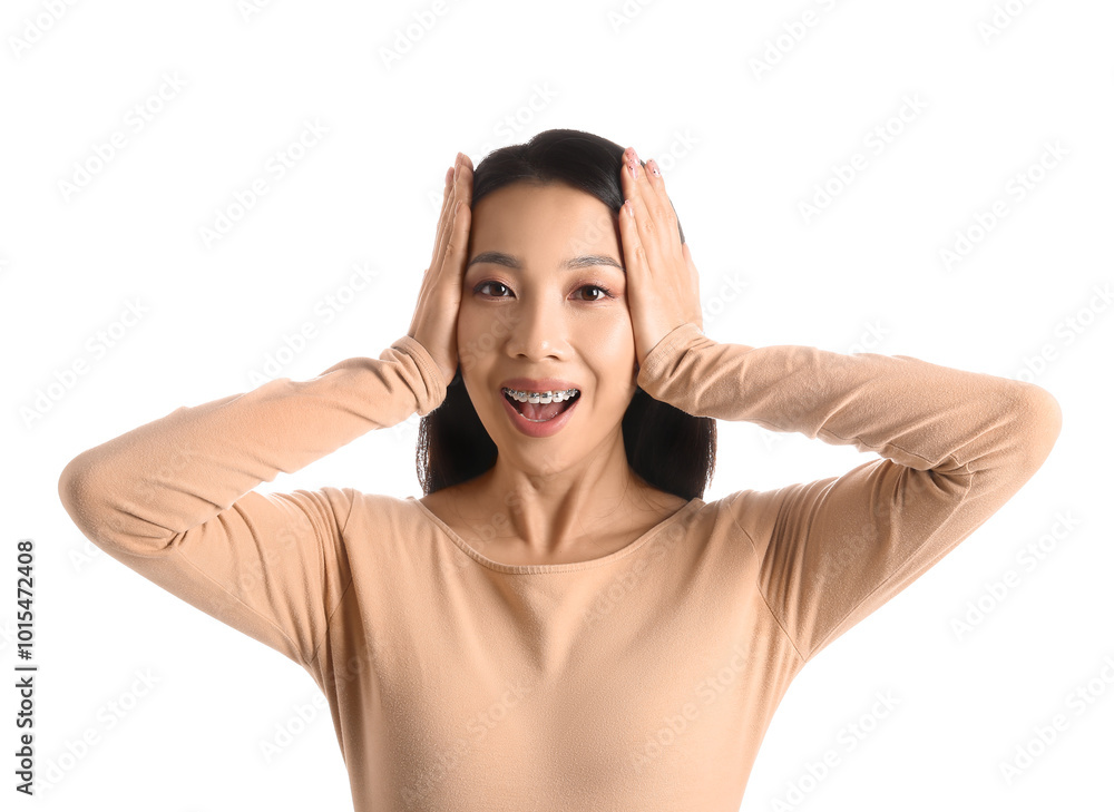 Portrait of surprised young Asian woman on white background Portrait of surprised young Asian woman on white background