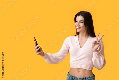 Young woman with mobile pho...
