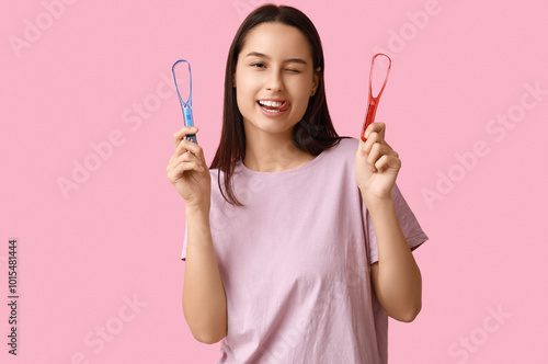 Funny young woman with tong...