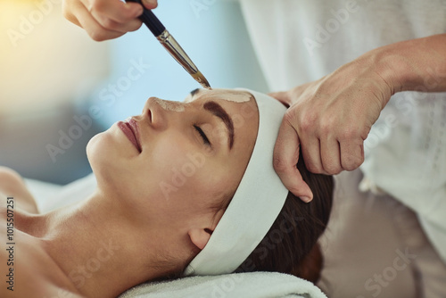 Woman, spa and brush for mask on bed, hands and care with skincare, relax and holiday at luxury resort. Person, cosmetics and tools for application, moisturizer or exfoliation at lodge for benefits