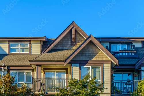 Wallpaper Mural A perfect neighborhood. Houses in suburb at Fall in the north America. Top of a luxury house with nice window over blue sky. Torontodigital.ca