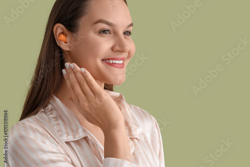 Young woman in pajamas with...