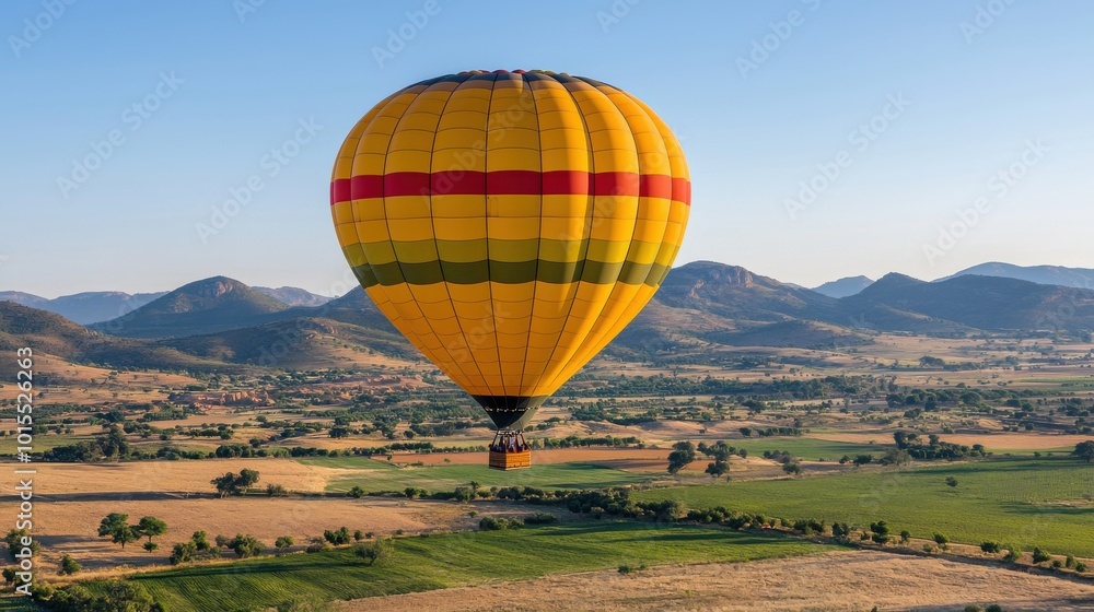 Obraz premium Hot air balloon ride over a scenic landscape, adventurous vacation