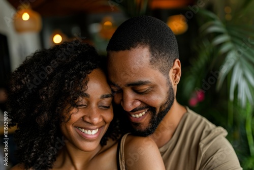 Portrait of a happy african american couple embracing in a cafe